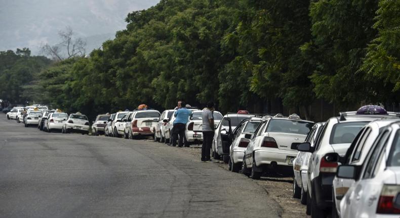 Drivers lining up to buy gasoline in crisis-hit Venezuela, close to the border with Colombia, where the US military is shipping another 200 tons of military aid