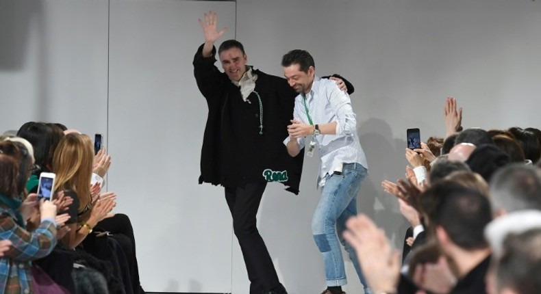 Designers Raf Simons (L) and Pieter Mulier walk the runway at the Calvin Klein show at New York Fashion Week on February 10, 2017