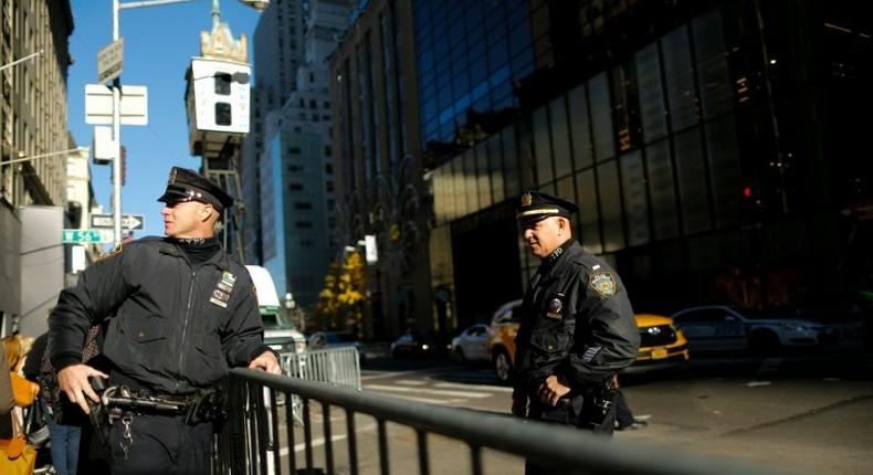New York police patrol in front of Trump Tower in New York where Donald Trump has spent most of the time since his election causing havoc in the heart of the city