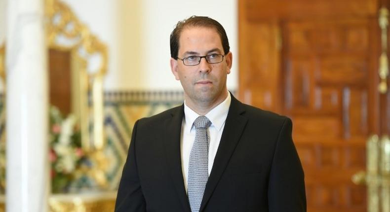 Tunisia's newly appointed prime minister-delegate Youssef Chahed poses for photographers after being appointed by the Tunisian president at Carthage Palace in Carthage, on August 3, 2016 