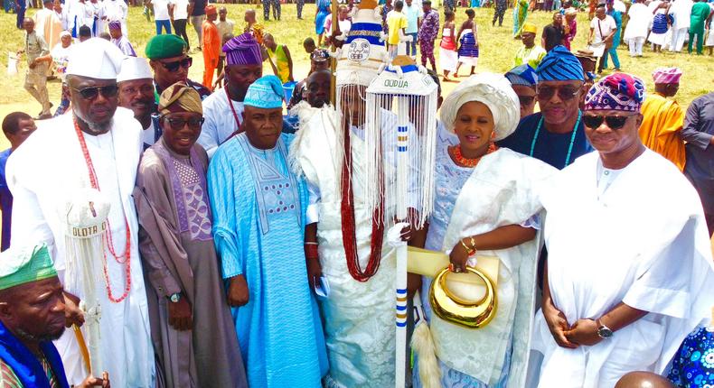 Middle: The monarch, Oba Olusola Idris Adebowale Lamidi-Osolo and his wife, Olori Taibat Lamidi-Osolo during the staff of office presentation ceremony. [Pulse]
