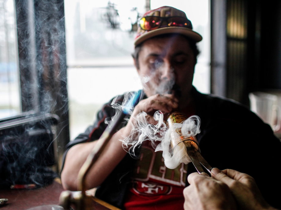 A medical marijuana patient smokes inside a sports bar in Olympia, Washington.