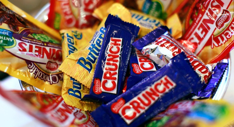 Nestle candy products are displayed the company's news conference in New York October 22, 2010. Nestle, the world's biggest food group, beat forecasts with a 5.7 percent rise in nine-month underlying sales thanks to strong demand in emerging markets, price rises and a thriving Nespresso coffee business.
