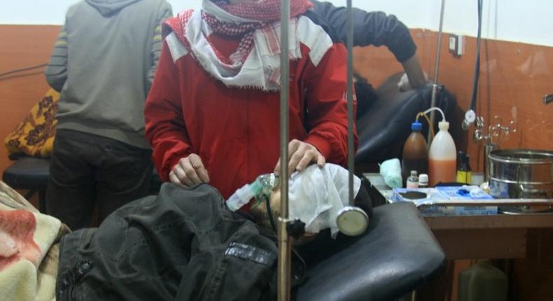 A picture shows people being treated at a field hospital after an alleged poison gas attack by troops loyal to President Bashar al-Assad in the rebel-held city of Daraya, southwest of the capital Damascus, on January 13, 2014