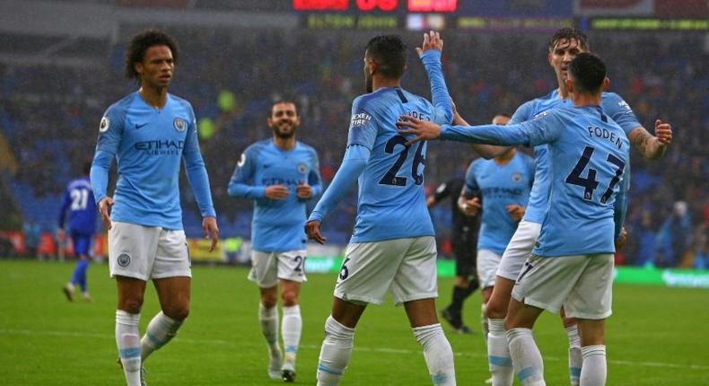 Manchester City's Riyad Mahrez celebrates with team-mates after scoring his second goal