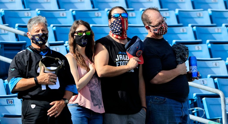 Fans stand for the national anthem before the game between the Tennessee Titans and the Jacksonville Jaguars at TIAA Bank Field on December 13, 2020.