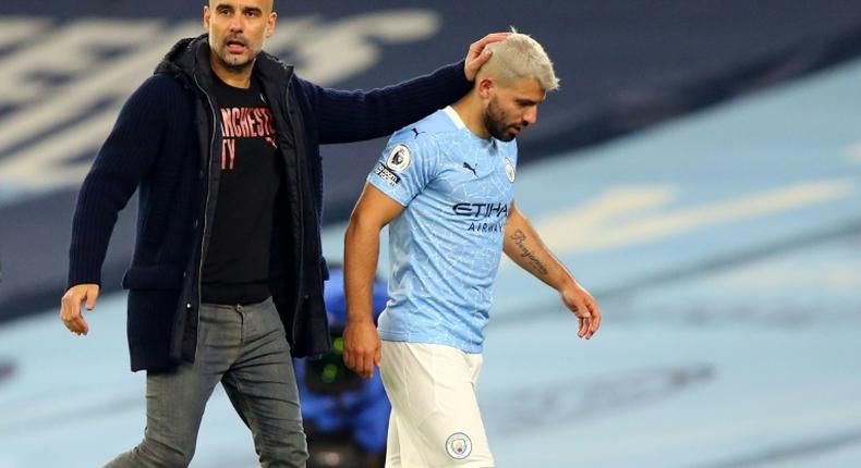 Manchester City striker Sergio Aguero (R) and his manager Pep Guardiola