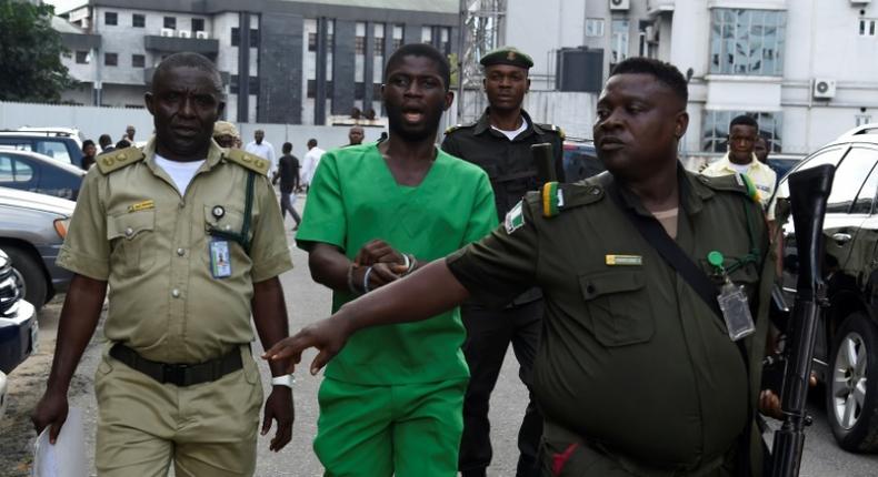 Gracious David-West (in green) has been sentenced to death by hanging [AFP]