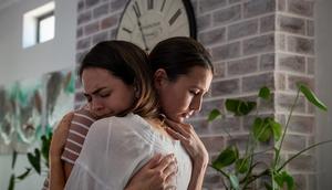 A woman comforts her friend with an embrace.nattrass/Getty Images