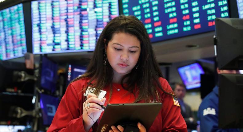 Traders work on the floor of the New York Stock Exchange shortly after the opening bell in New York, U.S., March 17, 2020.