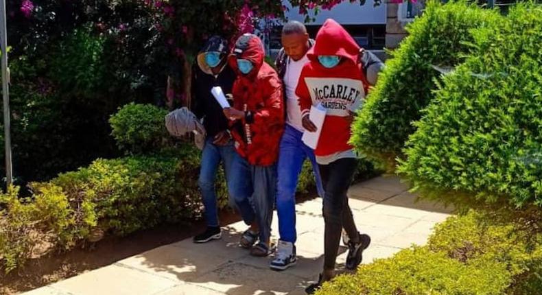 Acquitted suspects in the killing of fashion designer Edwin Chiloba being led out of court