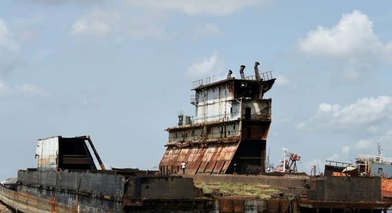 Graveyard: Dozens of shipwrecks and abandoned barges litter the Lagos waterways