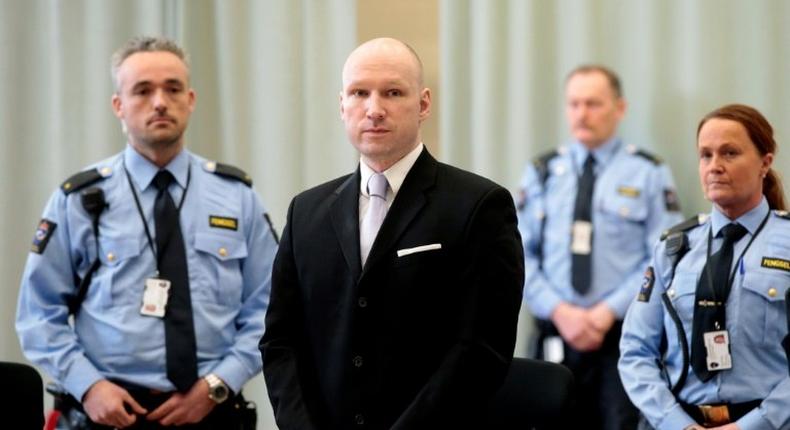 Norwegian mass killer Anders Behring Breivik, surrounded by prison guards, attends his fourth and last day in court in Skien prison, March 18, 2016