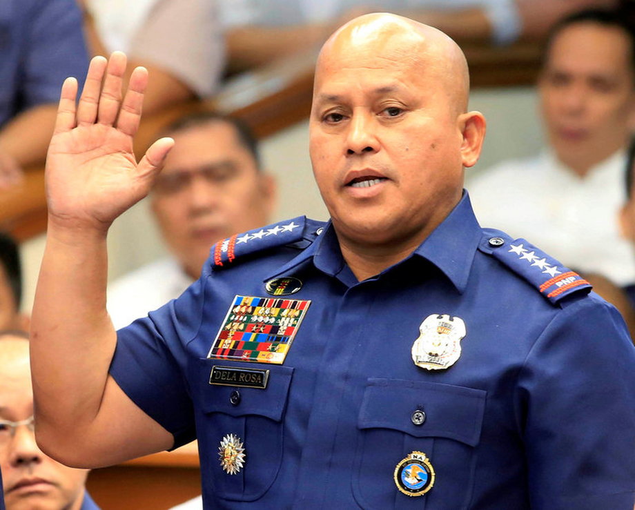 Philippine National Police (PNP) Director General Ronald Dela Rosa takes the oath during the start of a hearing investigating drug-related killings at the Senate headquarters in Manila.