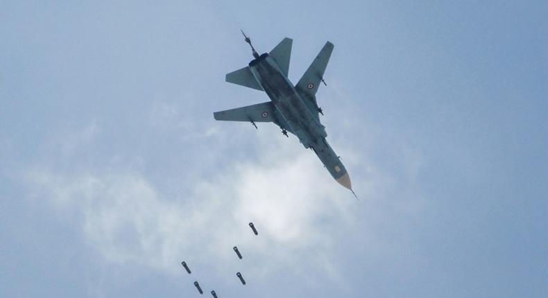 A Syrian warplane drops a payload on the rebel-held area of Qabun east of Damascus on May 6, 2017