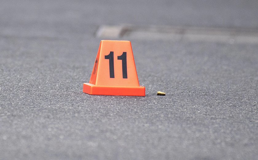 A Victoria Police personnel works at the scene of a multiple shooting outside Love Machine nightclub