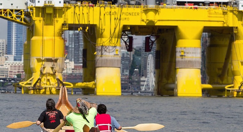 Environmental activists from the Duwamish Tribe protest the arrival of the Polar Pioneer, an oil drilling rig owned by Shell Oil, as it arrives on May 14, 2015 in Seattle, Washington.