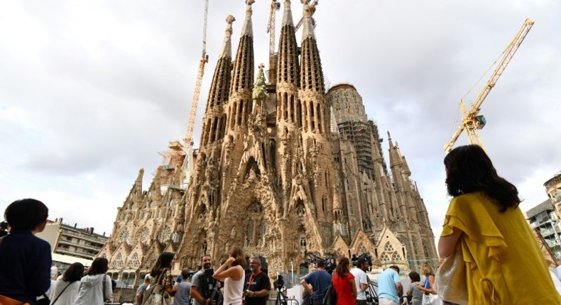 A grief-stricken Barcelona commemorates victims of two devastating terror attacks with a mass in the city's stunning Sagrada Familia church