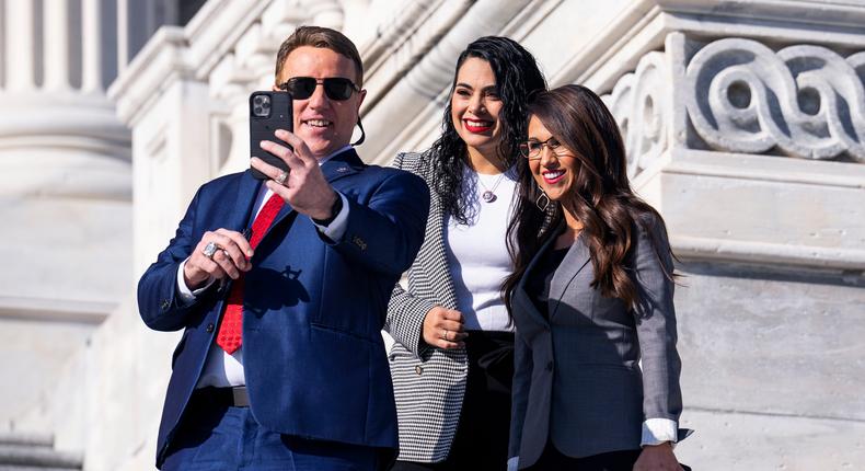 Rep. Pat Fallon (left), a Republican from Texas, takes a selfie with Reps. Mayra Flores, a fellow Republican of Texas (center), and Lauren Boebert, a Republican of Colorado (right), on the steps on the US Capitol.Tom Williams/CQ-Roll Call Inc. via Getty Images