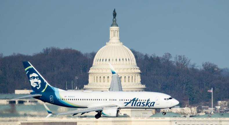 An Alaska Airlines plane flies past the Capitol in Washington, DC.Bill Clark/CQ-Roll Call, Inc via Getty Images