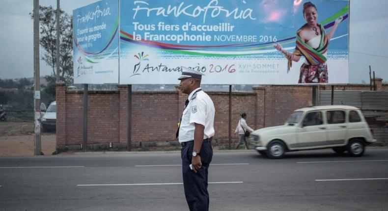 A Malagasy traffic policeman directs the traffic on the outskirts of Antananarivo on November 24, 2016