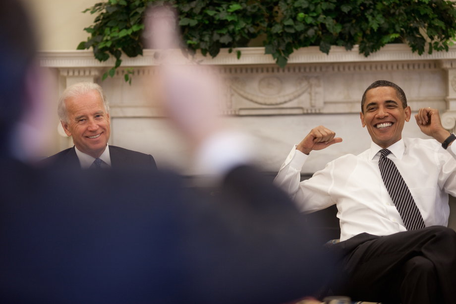 Obama and Biden react during a lighter moment at the daily economic briefing in the Oval Office on July 30, 2009.