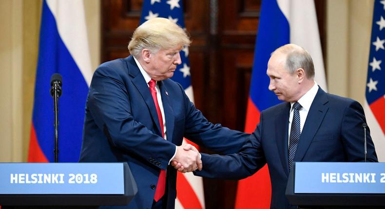 Former President Donald Trump shakes hands with Russian President Vladimir Putin during a joint press conference in Helsinki, Finland, on July 16, 2018.