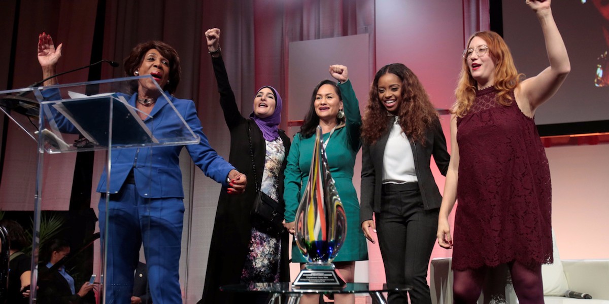 Rep. Maxine Waters speaks at the October Women's Convention with the national Women's March co-chairs.