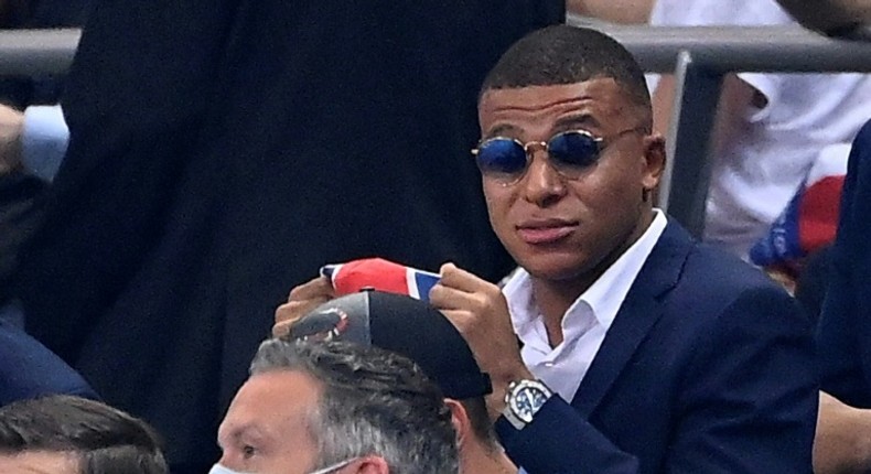 A dapper Kylian Mbappe watches Friday's French League Cup final from the stand -- the striker missed PSG's clash with Lyon because of an ankle injury