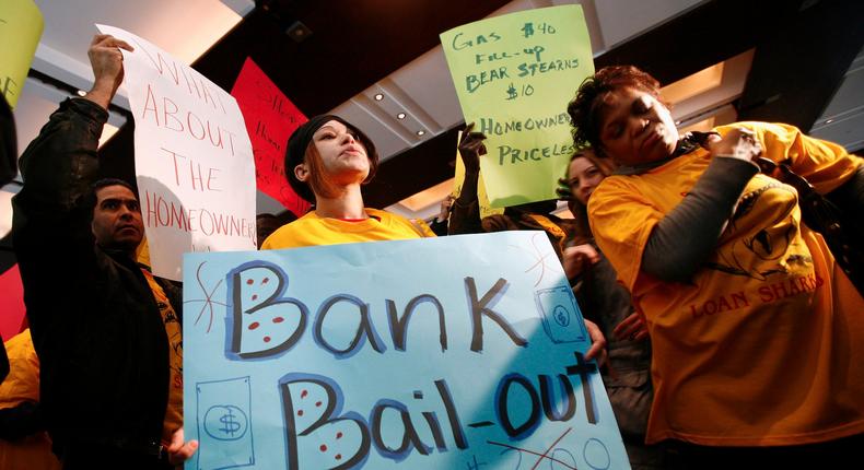 Demonstrators from the Neighborhood Assistance Corporation of America protest inside the Bear Stearns headquarters lobby in New York.