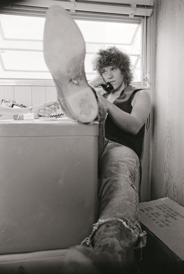 Michael Lang Talking on the Telephone