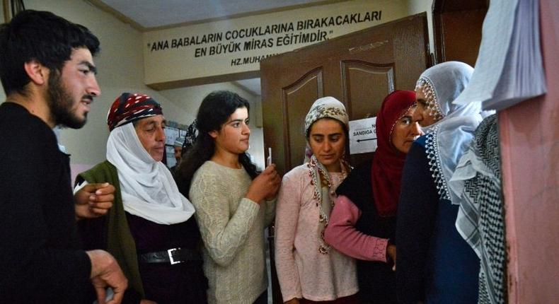 Voters queue to cast Turkish referendum ballots in the main Kurdish city of Diyarbakir