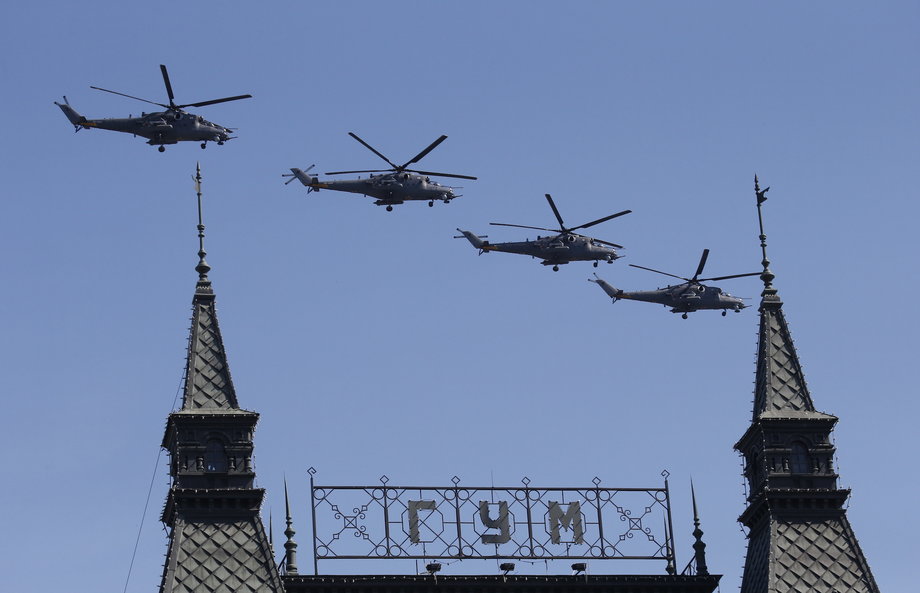 Russian Mi-28N military helicopters fly in formation during the Victory Day parade, marking the 71st anniversary of the victory over Nazi Germany in World War Two, above GUM department at Red Square in Moscow, Russia, May 9, 2016.