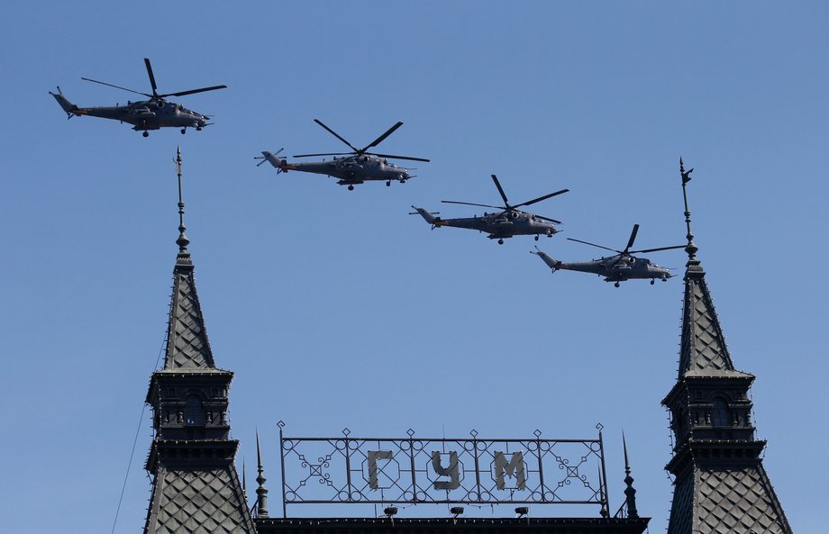 Russian Mi-28N military helicopters fly in formation during the Victory Day parade, marking the 71st anniversary of the victory over Nazi Germany in World War Two, above GUM department at Red Square in Moscow, Russia, May 9, 2016.