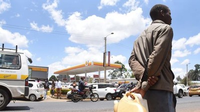A man with jerrycans waits to buy fuel in Eldoret town on April 3, 2022 amid a biting shortage. Kenya is staring at a fuel crisis due to delays in subsidy payouts by the government [Jared Naytaya | Nation Media Group]