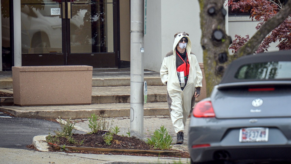 A man claiming to be in possession of a bomb exits the Fox45 television station which was evacuated due to a bomb threat in Baltimore