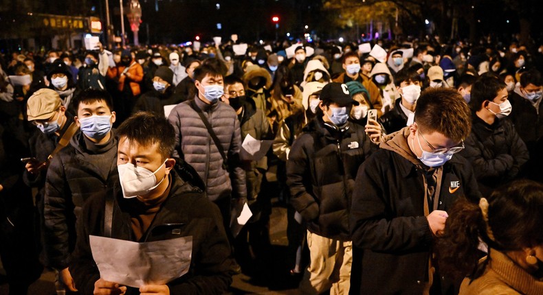 Protesters march in Beijing.Photo by NOEL CELIS/AFP via Getty Images