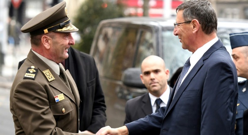 Israeli director-general of the Defense Ministry Udi Adam (R) shakes hands with Chief of General Staff of Croatian army Mirko Sundov prior to their meeting in which Adam said that Israel could not...implement the plan to sell F-16 jets to Croatia