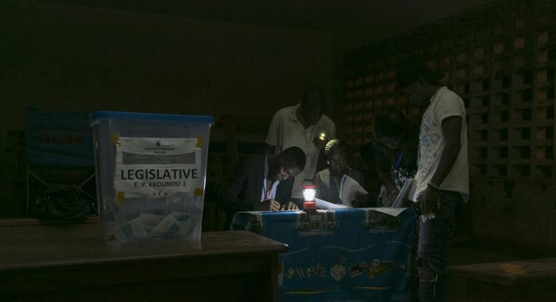 Electoral officials count votes after the February 2020 general and municipal elections in Yaounde, Cameroon
