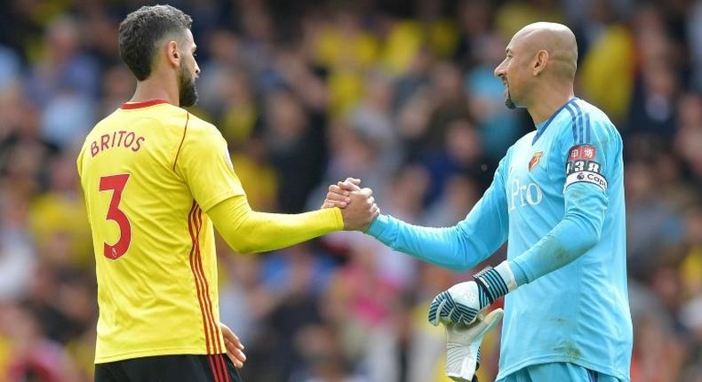 Watford's Uruguayan defender Miguel Britos (L) bundled the ball home deep in stoppage time after Simon Mignolet had pushed Richarlison's shot against the bar