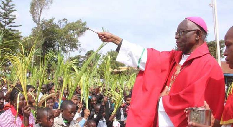 Archbishop Kairo blesses  faithful during Palm Sunday celebrations in Nyeri Town on March 29, 2015.