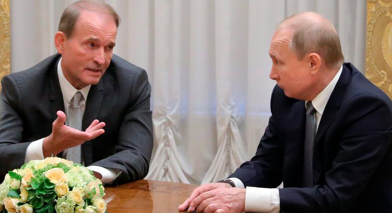 Russian President Vladimir Putin (right) and Ukrainian tycoon Viktor Medvedchuk during their meeting in St. Petersburg, Russia on July 18, 2019.