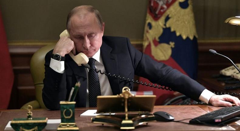 Russian President Vladimir Putin speaks on the phone in his office in Saint Petersburg on December 15, 2018.ALEXEY NIKOLSKY/AFP via Getty Images