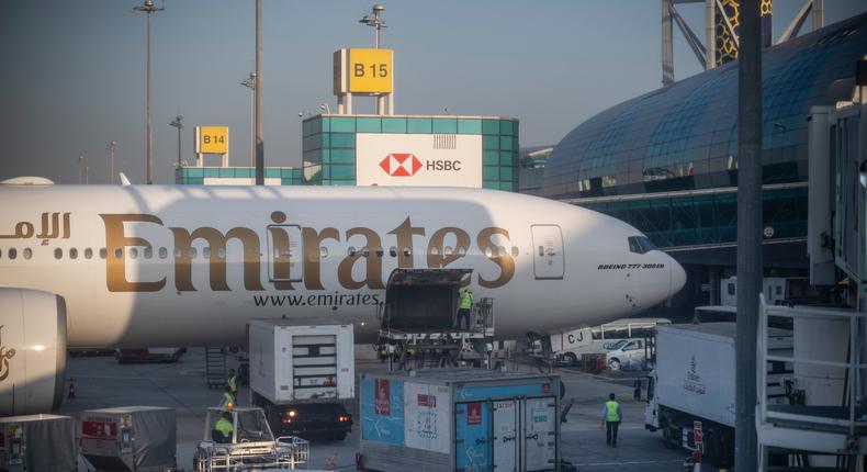 Ground personnel upload luggage and cargo containers onto an Emirates Boeing 777-300 ER aircraft at Dubai International Airport in March.Horacio Villalobos