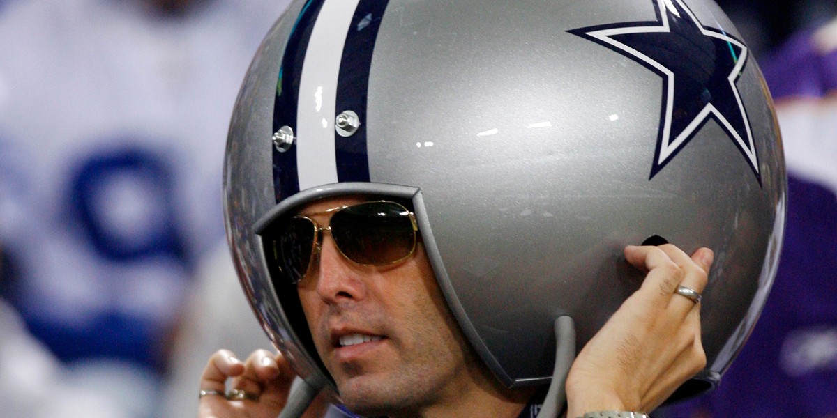 A Dallas Cowboys fan wears a giant helmet before the Cowboys play the Minnesota Vikings in their NFL Divisional playoff football game in Minneapolis, Minnesota, January 17, 2010.