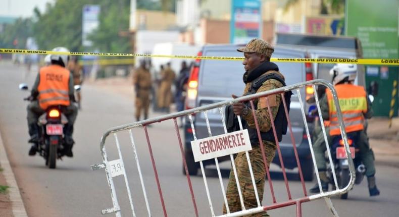 Burkina Faso police tighten security after gunmen attack a restaurant in the capital Ouagadougou, leaving 18 people dead