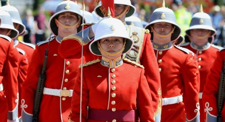 All change at the Guard: Captain Megan Couto has become the first female officer to command the elite troops protecting the queen at Buckingham Palace
