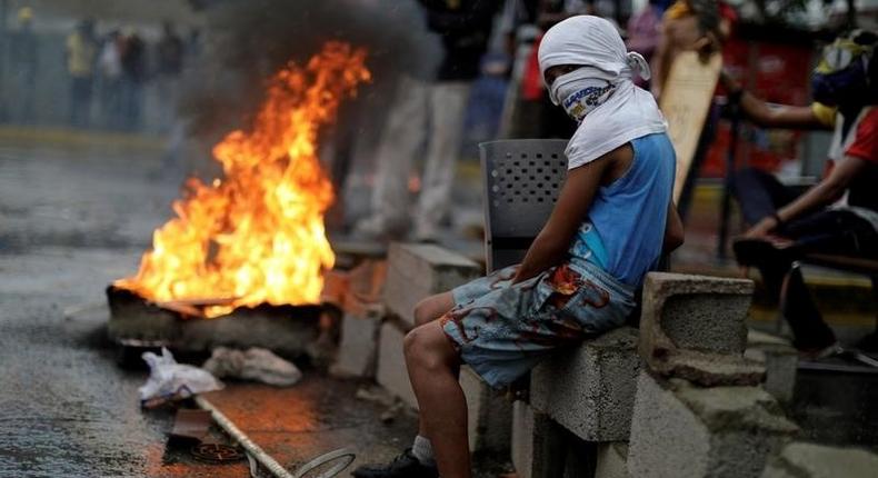 A demonstrator at a rally against Venezuelan President Nicolas Maduro's government in Caracas, August 4, 2017.