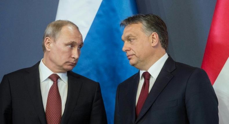 Eurosceptic Hungarian Prime Minister Viktor Orban (R) enjoys close ties with Russian President Vladimir Putin (L) but has yet to formally oppose sanctions on Russia