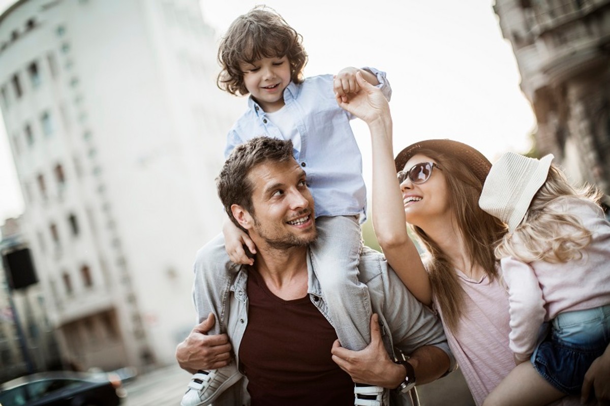 Close up of a young family enjoying city life